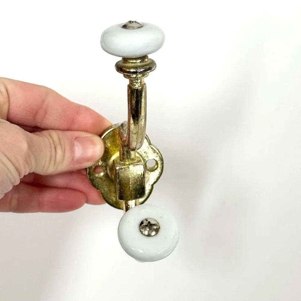 Vintage brass and porcelain double wall hook